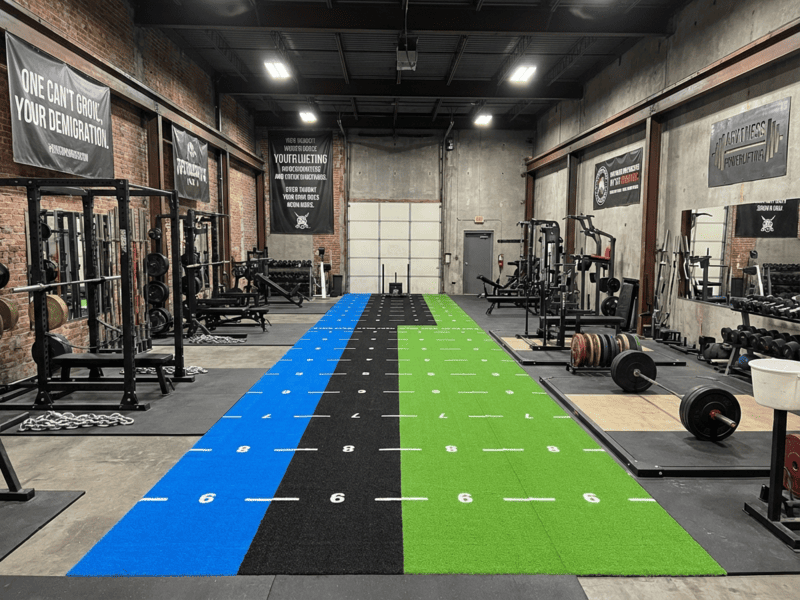 Diagram showing shear force vectors during a sled push on gym turf